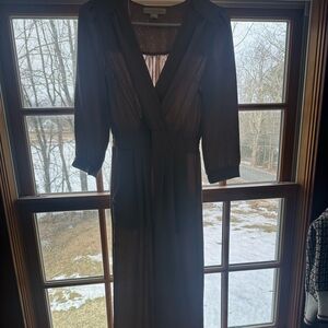 small, neutral colored jump suit, never worn before